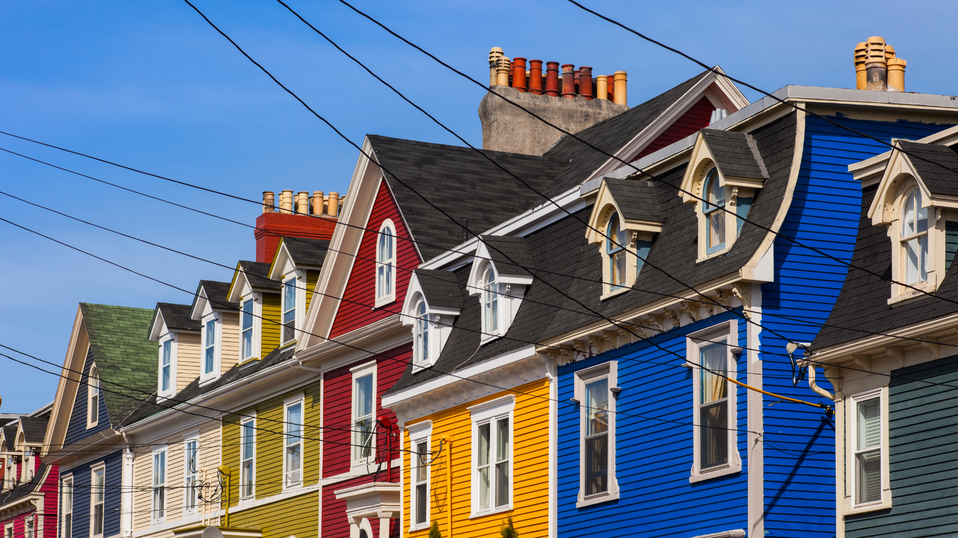 Signal Hill and St. John’s harbour at sunrise with colourful row houses