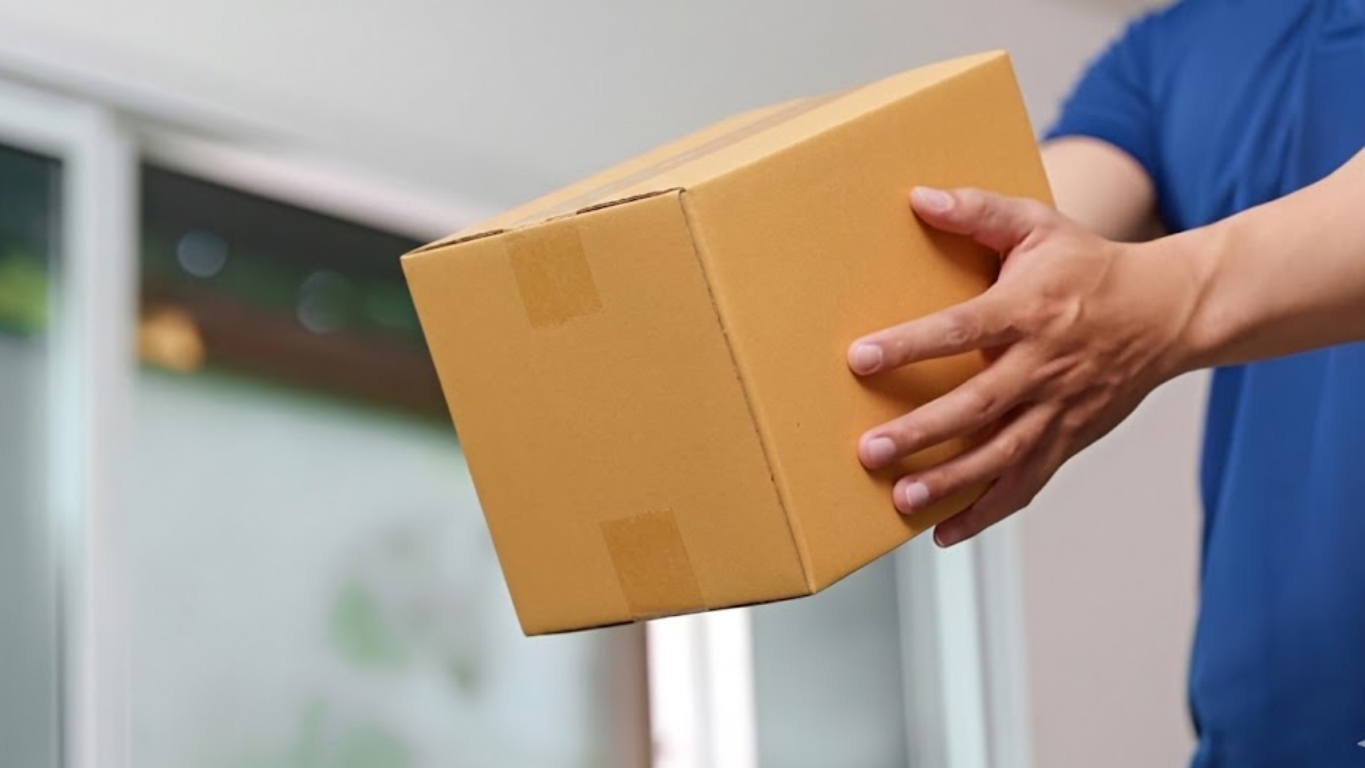 Delivery person handing over a package.