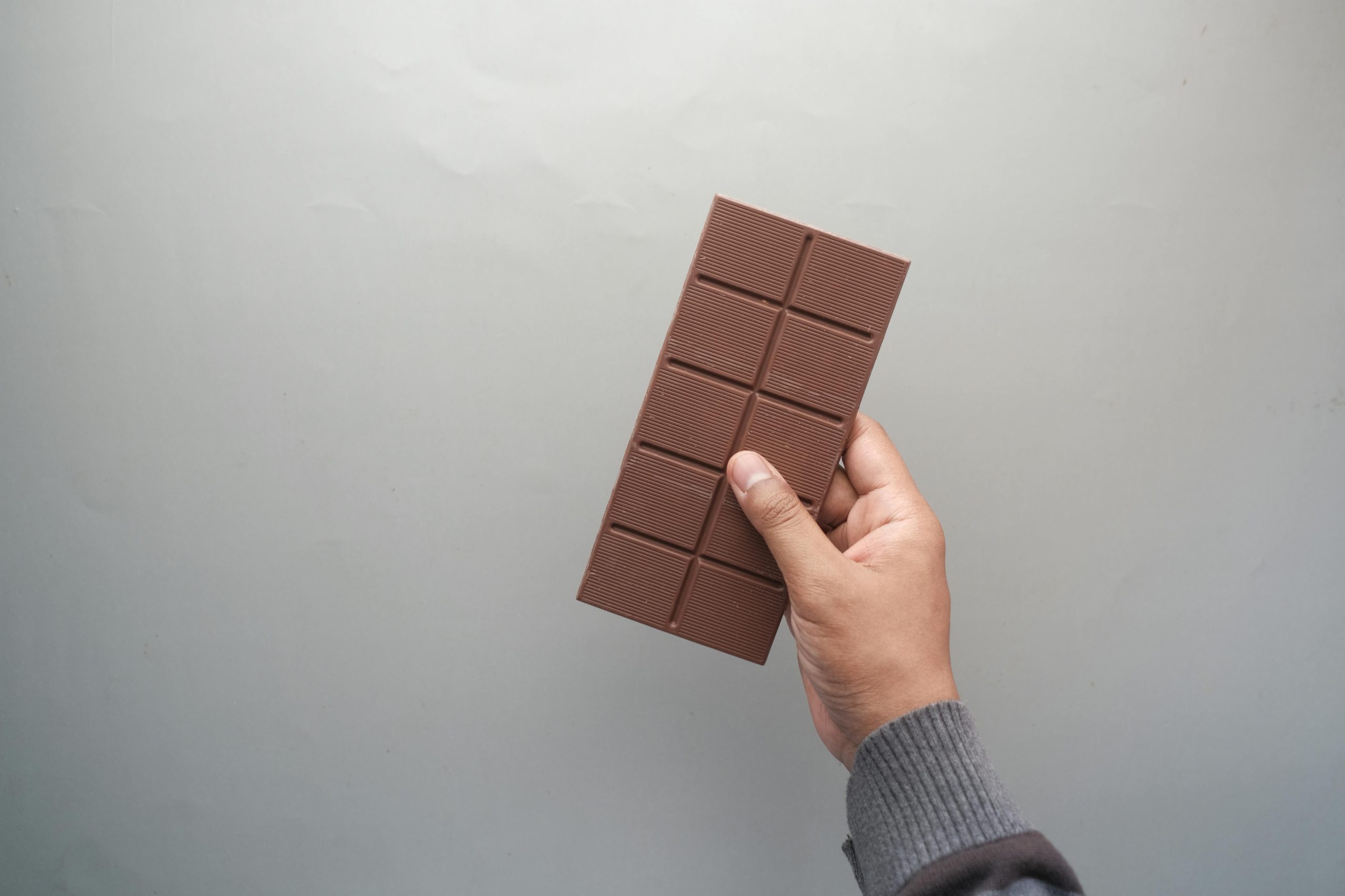 hand holing chocolate bar